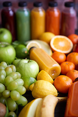 Image showing Colorful bottles filled with fresh fruit and vegetable juice or smoothie