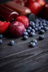 Image showing Mix of fresh red and black fruits. With botteled fresh juices