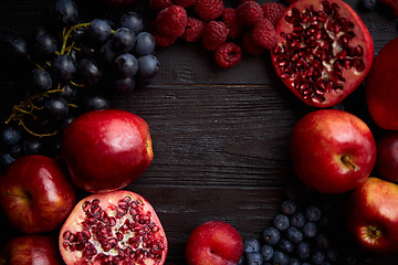 Image showing Mix of fresh red and black fruits. With botteled fresh juices