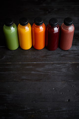 Image showing Colorful bottles filled with fresh fruit and vegetable juice or smoothie