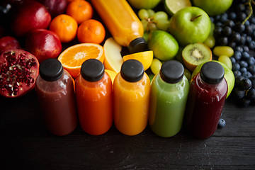 Image showing Colorful bottles filled with fresh fruit and vegetable juice or smoothie