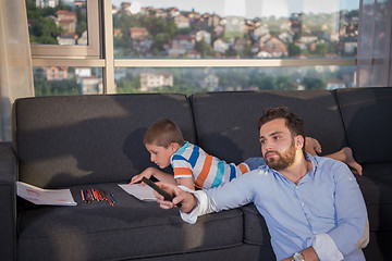 Image showing Happy Young Family Playing Together on sofa