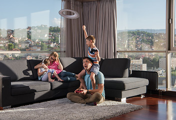 Image showing Happy family playing a video game