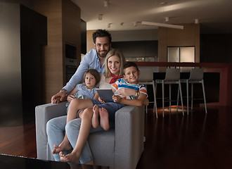 Image showing happy young couple spending time with kids