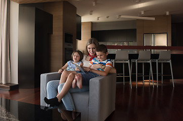 Image showing happy young mother spending time with kids