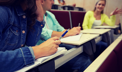 Image showing group of students with notebooks at lecture hall