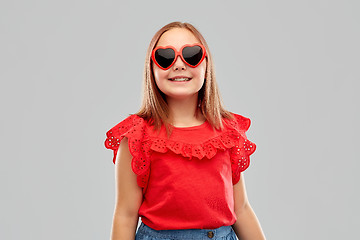 Image showing smiling preteen girl with heart shaped sunglasses