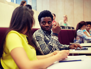 Image showing group of students with notebooks at lecture hall