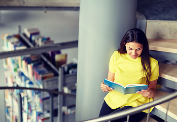 Image showing high school student girl reading book at library