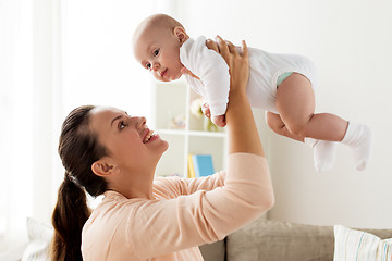 Image showing happy mother playing with little baby boy at home