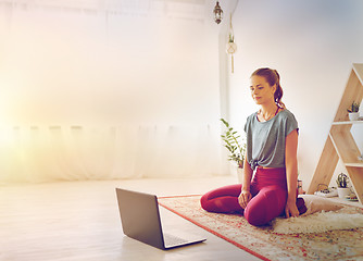 Image showing woman with laptop computer at yoga studio