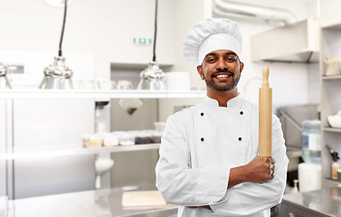 Image showing indian chef or baker with rolling-pin at kitchen