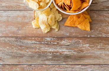 Image showing close up of potato crisps and nachos in bowls