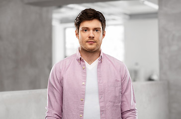 Image showing young man over concrete grey office room