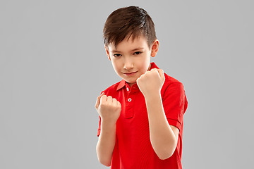 Image showing boy in red t-shirt showing fists or boxing