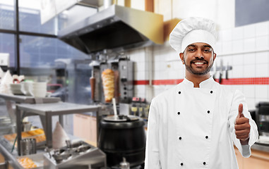 Image showing happy indian chef showing thumbs up at kebab shop