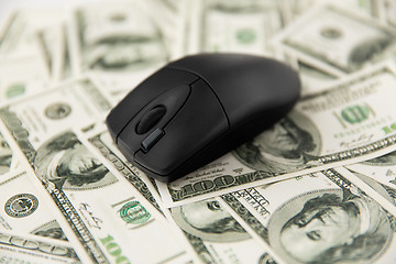 Image showing close up of computer mouse on us dollar money