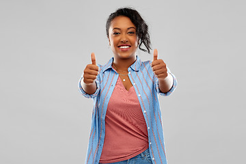 Image showing happy african american woman showing thumbs up