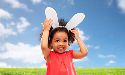 Image showing happy little girl wearing easter bunny ears