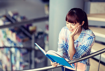 Image showing high school student girl reading book at library