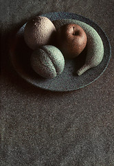 Image showing Granite-like sculpture of fruit on a plate