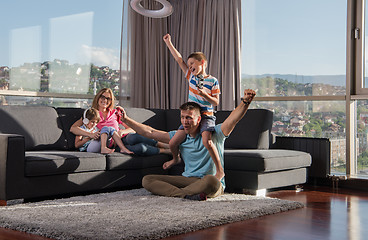 Image showing Happy family playing a video game