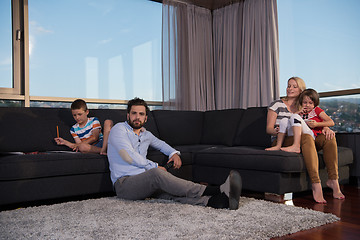 Image showing Happy Young Family Playing Together on sofa