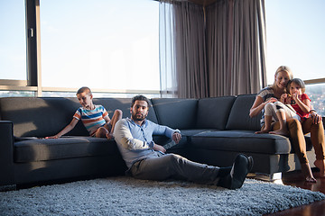 Image showing Happy Young Family Playing Together on sofa