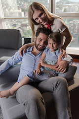 Image showing happy young couple spending time with kids