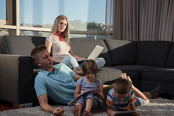 Image showing young couple spending time with kids at home