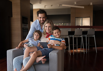 Image showing happy young couple spending time with kids