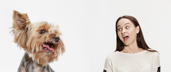 Image showing Woman with her dog over white background