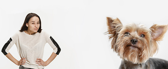 Image showing Woman with her dog on leash over white background
