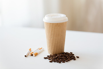 Image showing close up of cigarettes, coffee cup and beans