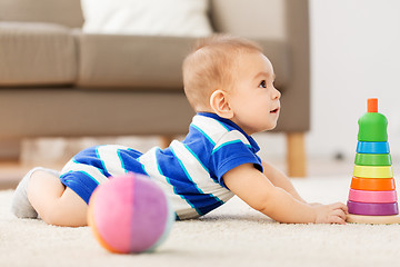 Image showing sweet little asian baby boy playing with toy ball