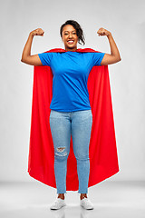 Image showing happy african american woman in superhero red cape