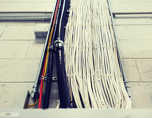 Image showing group of electricity cables at wall
