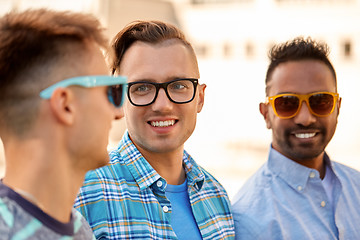 Image showing happy young men in glasses and sunglasses outdoors