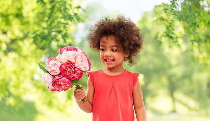 Image showing happy little african american girl with flowers