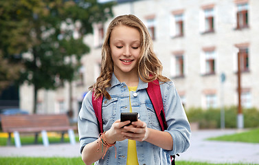 Image showing teen student girl with school bag and smartphone