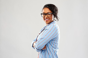 Image showing confident african american woman with crossed arms