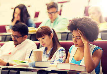 Image showing group of students with coffee writing on lecture