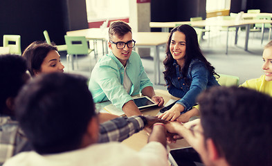 Image showing group of international students with hands on top