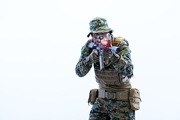 Image showing soldier in action aiming laseer sight optics