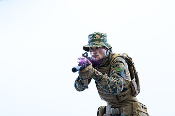 Image showing soldier in action aiming laseer sight optics