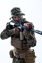 Image showing soldier in action aiming laseer sight optics