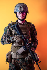 Image showing modern soldier against yellow background