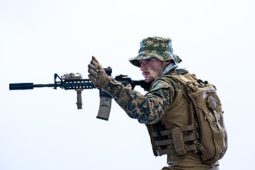 Image showing soldier in action aiming laseer sight optics