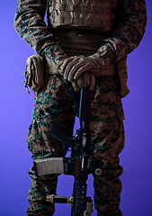 Image showing modern warfare soldier purple backgorund