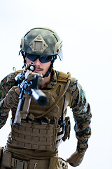 Image showing soldier in action aiming laseer sight optics